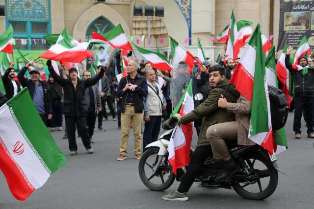 (260301) -- TEHRAN, March 1, 2026 (Xinhua) -- People attend a protest against U.S.-Israeli attacks on Iran, in Tehran, Iran, Feb. 28, 2026.
  The United States and Israel on Saturday launched "major combat operations" against Iran, plunging the war-torn Middle East into a new round of violent conflicts.
Iran has retaliated with a series of counterattacks against Israel and U.S. targets across the region, with explosions reported in Bahrain, Qatar, Kuwait, Jordan, the United Arab Emirates (UAE), and Saudi Arabia, among other countries. (Xinhua)