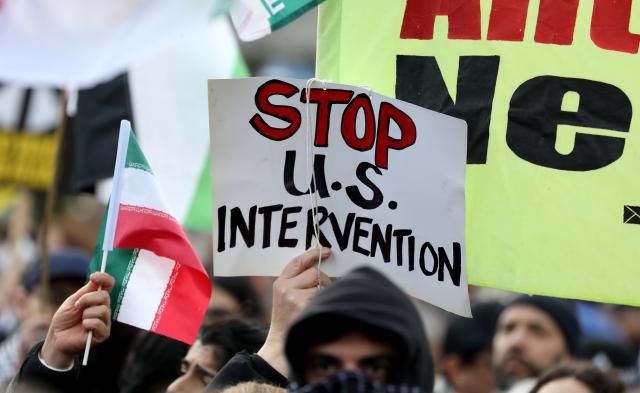 (260301) -- LONDON, March 1, 2026 (Xinhua) -- People hold placards during a protest against U.S.-Israeli attacks on Iran, at the Parliament Square in central London, Britain, on Feb. 28, 2026. The United States and Israel on Saturday launched "major combat operations" against Iran, plunging the war-torn Middle East into a new round of violent conflicts.
   Iran has retaliated with a series of counterattacks against Israel and U.S. targets across the region, with explosions reported in Bahrain, Qatar, Kuwait, Jordan, the United Arab Emirates (UAE), and Saudi Arabia, among other countries. (Xinhua/Li Ying)