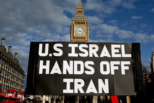 (260301) -- LONDON, March 1, 2026 (Xinhua) -- People hold a placard during a protest against U.S.-Israeli attacks on Iran, at the Parliament Square in central London, Britain, on Feb. 28, 2026. The United States and Israel on Saturday launched "major combat operations" against Iran, plunging the war-torn Middle East into a new round of violent conflicts.
   Iran has retaliated with a series of counterattacks against Israel and U.S. targets across the region, with explosions reported in Bahrain, Qatar, Kuwait, Jordan, the United Arab Emirates (UAE), and Saudi Arabia, among other countries. (Xinhua/Li Ying)