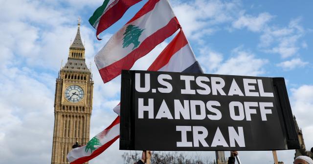 (260301) -- LONDON, March 1, 2026 (Xinhua) -- People hold a placard during a protest against U.S.-Israeli attacks on Iran, at the Parliament Square in central London, Britain, on Feb. 28, 2026. The United States and Israel on Saturday launched "major combat operations" against Iran, plunging the war-torn Middle East into a new round of violent conflicts.
   Iran has retaliated with a series of counterattacks against Israel and U.S. targets across the region, with explosions reported in Bahrain, Qatar, Kuwait, Jordan, the United Arab Emirates (UAE), and Saudi Arabia, among other countries. (Xinhua/Li Ying)