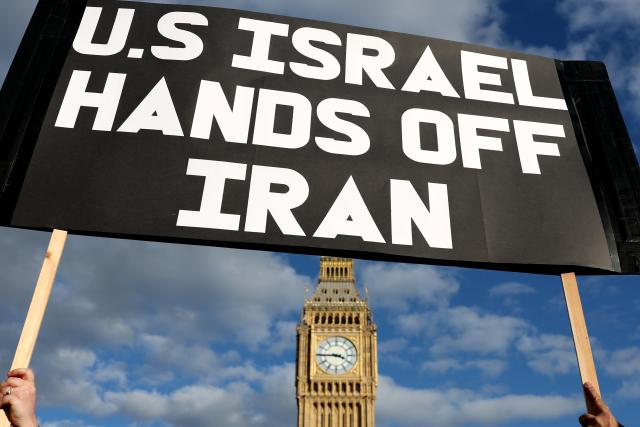 (260301) -- LONDON, March 1, 2026 (Xinhua) -- People hold a placard during a protest against U.S.-Israeli attacks on Iran, at the Parliament Square in central London, Britain, on Feb. 28, 2026. The United States and Israel on Saturday launched "major combat operations" against Iran, plunging the war-torn Middle East into a new round of violent conflicts.
   Iran has retaliated with a series of counterattacks against Israel and U.S. targets across the region, with explosions reported in Bahrain, Qatar, Kuwait, Jordan, the United Arab Emirates (UAE), and Saudi Arabia, among other countries. (Xinhua/Li Ying)