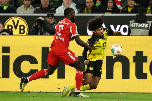 (260301) -- DORTMUND, March 1, 2026 (Xinhua) -- Dayot Upamecano (L) of FC Bayern Munich vies with Karim Adeyemi of Borussia Dortmund during the German first division Bundesliga football match between FC Bayern Munich and Borussia Dortmund in Dortmund, Germany, Feb. 28, 2026. (Photo by Joachim Bywaletz/Xinhua)
