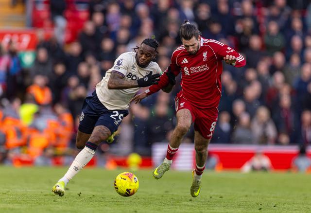 (260301) -- LIVERPOOL, March 1, 2026 (Xinhua) -- Liverpool's Dominik Szoboszlai (R) vies with West Ham United's Aaron Wan-Bissaka during the English Premier League match between Liverpool and West Ham United in Liverpool, Britain, on Feb. 28, 2026. (Xinhua)
FOR EDITORIAL USE ONLY. NOT FOR SALE FOR MARKETING OR ADVERTISING CAMPAIGNS. NO USE WITH UNAUTHORIZED AUDIO, VIDEO, DATA, FIXTURE LISTS, CLUB/LEAGUE LOGOS OR "LIVE" SERVICES. ONLINE IN-MATCH USE LIMITED TO 45 IMAGES, NO VIDEO EMULATION. NO USE IN BETTING, GAMES OR SINGLE CLUB/LEAGUE/PLAYER PUBLICATIONS.
