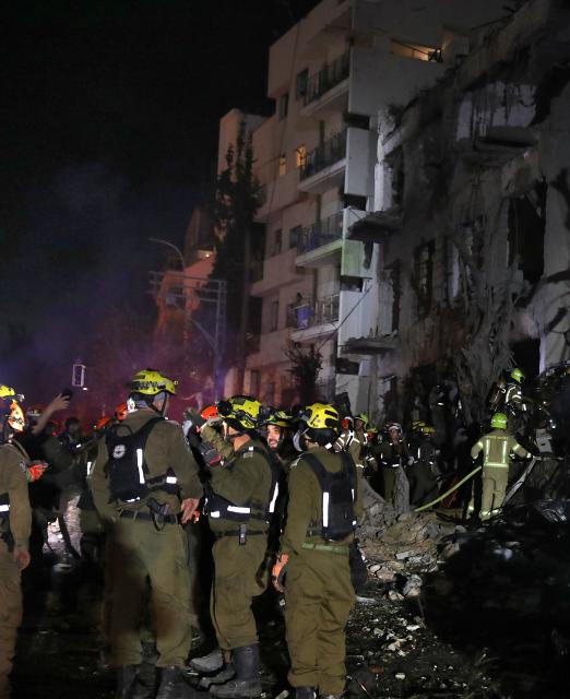 (260301) -- TEL AVIV, March 1, 2026 (Xinhua) -- Members of the Israeli security and rescue forces work at the scene where a ballistic missile fired from Iran hit and caused damage in Tel Aviv, Israel, early on March 1, 2026.
  The United States and Israel on Saturday launched "major combat operations" against Iran, claiming that the country's Supreme Leader Ayatollah Ali Khamenei had been killed.
  Iran retaliated with a series of counterattacks against Israel and U.S. targets across the region.
  Late Saturday, at least 20 people were injured in Tel Aviv during Iran's latest round of strikes on Israel, Israel's national emergency service MDA reported. MDA said that a 40-year-old man is in a serious condition with a shrapnel wound. (Gideon Markowicz/JINI via Xinhua)