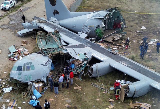 (260301) -- EL ALTO, March 1, 2026 (Xinhua) -- A drone photo taken on Feb. 28, 2026 shows a military plane crash site at El Alto International Airport in El Alto, Bolivia. The death toll from a plane crash in the Bolivian city of El Alto on Friday has risen to 22, including four children, Health Minister Marcela Flores confirmed on Saturday.
   The crash occurred Friday night when a Bolivian Air Force Hercules C-130 military aircraft veered off the runway upon landing at El Alto International Airport and collided with public roads. Dozens were injured and about 20 vehicles, including public transport, were destroyed. (Photo by Javier Mamani/Xinhua)