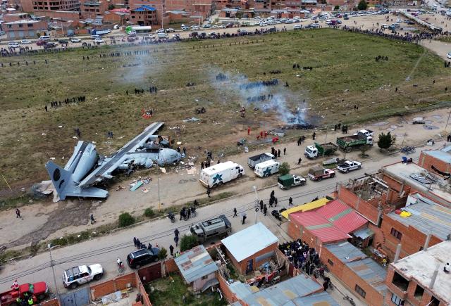(260301) -- EL ALTO, March 1, 2026 (Xinhua) -- An aerial drone photo taken on Feb. 28, 2026 shows a military plane crash site at El Alto International Airport in El Alto, Bolivia. The death toll from a plane crash in the Bolivian city of El Alto on Friday has risen to 22, including four children, Health Minister Marcela Flores confirmed on Saturday.
   The crash occurred Friday night when a Bolivian Air Force Hercules C-130 military aircraft veered off the runway upon landing at El Alto International Airport and collided with public roads. Dozens were injured and about 20 vehicles, including public transport, were destroyed. (Photo by Javier Mamani/Xinhua)