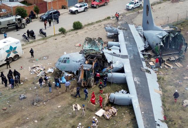 (260301) -- EL ALTO, March 1, 2026 (Xinhua) -- A drone photo taken on Feb. 28, 2026 shows a military plane crash site at El Alto International Airport in El Alto, Bolivia. The death toll from a plane crash in the Bolivian city of El Alto on Friday has risen to 22, including four children, Health Minister Marcela Flores confirmed on Saturday.
   The crash occurred Friday night when a Bolivian Air Force Hercules C-130 military aircraft veered off the runway upon landing at El Alto International Airport and collided with public roads. Dozens were injured and about 20 vehicles, including public transport, were destroyed. (Photo by Javier Mamani/Xinhua)
