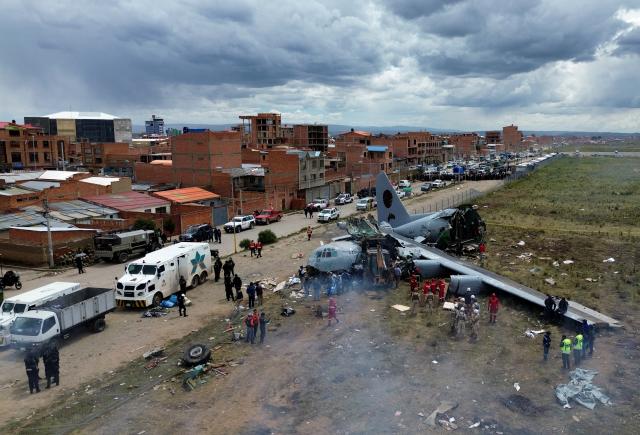 (260301) -- EL ALTO, March 1, 2026 (Xinhua) -- A drone photo taken on Feb. 28, 2026 shows a military plane crash site at El Alto International Airport in El Alto, Bolivia. The death toll from a plane crash in the Bolivian city of El Alto on Friday has risen to 22, including four children, Health Minister Marcela Flores confirmed on Saturday.
   The crash occurred Friday night when a Bolivian Air Force Hercules C-130 military aircraft veered off the runway upon landing at El Alto International Airport and collided with public roads. Dozens were injured and about 20 vehicles, including public transport, were destroyed. (Photo by Javier Mamani/Xinhua)