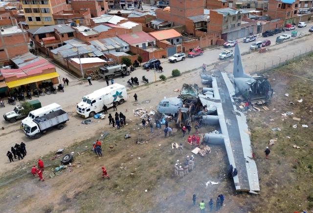 (260301) -- EL ALTO, March 1, 2026 (Xinhua) -- A drone photo taken on Feb. 28, 2026 shows a military plane crash site at El Alto International Airport in El Alto, Bolivia. The death toll from a plane crash in the Bolivian city of El Alto on Friday has risen to 22, including four children, Health Minister Marcela Flores confirmed on Saturday.
   The crash occurred Friday night when a Bolivian Air Force Hercules C-130 military aircraft veered off the runway upon landing at El Alto International Airport and collided with public roads. Dozens were injured and about 20 vehicles, including public transport, were destroyed. (Photo by Javier Mamani/Xinhua)