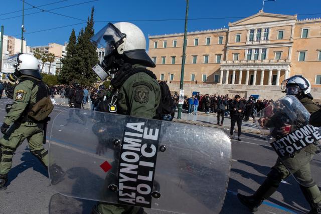 (260301) -- ATHENS, March 1, 2026 (Xinhua) -- Greek riot police officers stand guard in front of the Hellenic Parliament at Syntagma Square in Athens, Greece, Feb. 28, 2026. Thousands of people took part in dozens of demonstrations across Greece on Saturday to mark the third anniversary of the train collision in Tempi, central Greece, which claimed 57 lives. (Xinhua/Marios Lolos)
