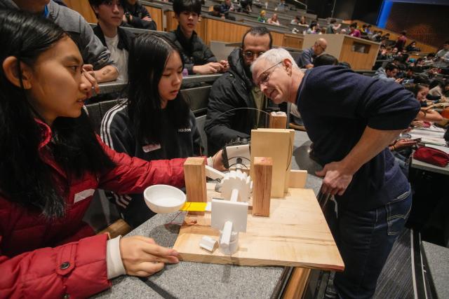 (260301) -- VANCOUVER, March 1, 2026 (Xinhua) -- A judge (R) examines a projectile launcher during the 48th annual Physics Olympics at the University of British Columbia in Vancouver, British Columbia, Canada, on Feb. 28, 2026. More than 1,000 high school students from across the Canadian province of British Columbia participated in the 48th annual Physics Olympics held here on Saturday. (Photo by Liang Sen/Xinhua)