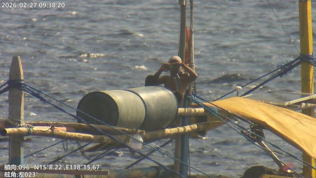 (260301) -- SOUTH CHINA SEA, March 1, 2026 (Xinhua) -- A crew member of a Philippine vessel films China Coast Guard (CCG) vessels and law enforcers in waters off China's Huangyan Dao in the South China Sea, Feb. 27, 2026. The CCG on Friday drove away Philippine vessels that illegally intruded into China's territorial waters off Huangyan Dao in the South China Sea. (CCG/Handout via Xinhua)