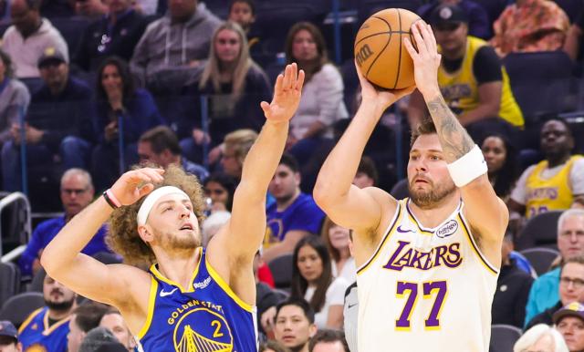 (260301) -- SAN FRANCISCO, March 1, 2026 (Xinhua) -- Luka Doncic (R) of Los Angeles Lakers shoots during the 2025-2026 NBA regular season basketball game between Los Angeles Lakers and Golden State Warriors in San Francisco, the United States, Feb. 28, 2026. (Photo by Dong Xudong/Xinhua)