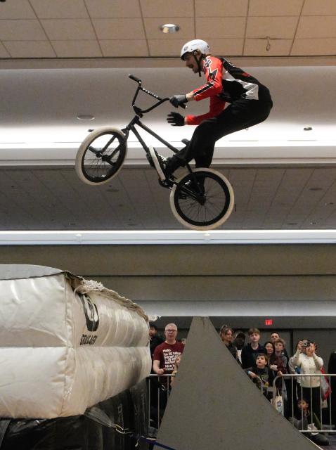 (260301) -- VANCOUVER, March 1, 2026 (Xinhua) -- A man shows off freestyle BMX skills during the 2026 BC Bike Show in Vancouver, British Columbia, Canada, on Feb. 28, 2026. The two-day bicycle consumer show showcased the latest products from around 60 exhibitors. (Photo by Liang Sen/ Xinhua)