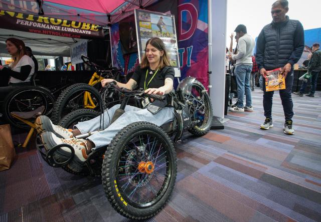 (260301) -- VANCOUVER, March 1, 2026 (Xinhua) -- A woman sits in an electric-assist mountain tricycle during the 2026 BC Bike Show in Vancouver, British Columbia, Canada, on Feb. 28, 2026. The two-day bicycle consumer show showcased the latest products from around 60 exhibitors. (Photo by Liang Sen/ Xinhua)