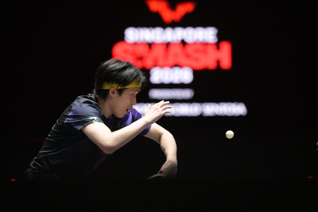 (260301) -- SINGAPORE, March 1, 2026 (Xinhua) -- Wang Chuqin hits a return during the men's singles semifinal between Wang Chuqin of China and Felix Lebrun of France at the World Table Tennis (WTT) Singapore Smash 2026 in Singapore on March 1, 2026. (Photo by Then Chih Wey/Xinhua)