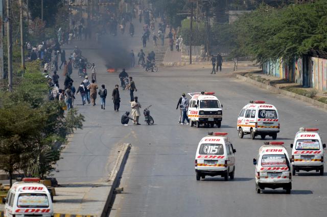 (260301) -- KARACHI, March 1, 2026 (Xinhua) -- Ambulances are seen as protestors clash with law enforcement personnel near U.S. Consulate in southern Pakistani port city of Karachi on March 1, 2026. At least nine people were killed and more than 12 others injured on Sunday as angry protesters clashed with law enforcement personnel outside the U.S. Consulate in Karachi in the southern Sindh province, rescue officials said. (Photo by Imran Ali/Xinhua)