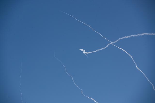 (260301) -- TEL AVIV, March 1, 2026 (Xinhua) -- This photo taken on March 1, 2026 shows smoke trails left by interceptor missiles launched from Israeli air defense systems in downtown Tel Aviv, Israel. Multiple explosions were heard in Tel Aviv on Sunday, eyewitnesses said, as Israel's military said it was operating to intercept new barrages of missiles from Iran that triggered air raid sirens across the country. (Xinhua/Chen Junqing)
