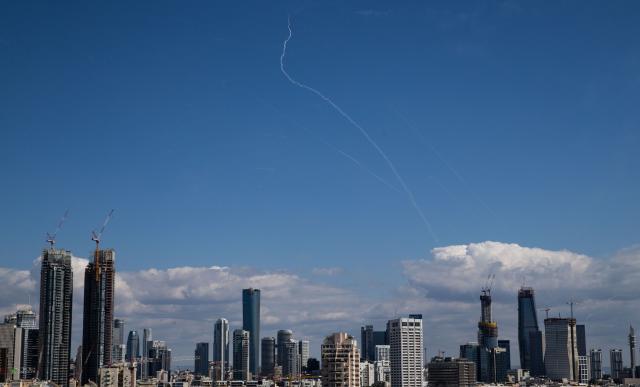 (260301) -- TEL AVIV, March 1, 2026 (Xinhua) -- This photo taken on March 1, 2026 shows smoke trails left by interceptor missiles launched from Israeli air defense systems in downtown Tel Aviv, Israel. Multiple explosions were heard in Tel Aviv on Sunday, eyewitnesses said, as Israel's military said it was operating to intercept new barrages of missiles from Iran that triggered air raid sirens across the country. (Xinhua/Chen Junqing)