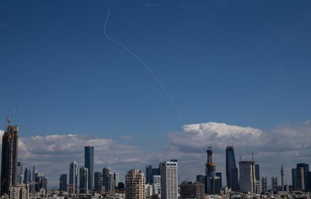 (260301) -- TEL AVIV, March 1, 2026 (Xinhua) -- This photo taken on March 1, 2026 shows smoke trails left by interceptor missiles launched from Israeli air defense systems in downtown Tel Aviv, Israel. Multiple explosions were heard in Tel Aviv on Sunday, eyewitnesses said, as Israel's military said it was operating to intercept new barrages of missiles from Iran that triggered air raid sirens across the country. (Xinhua/Chen Junqing)