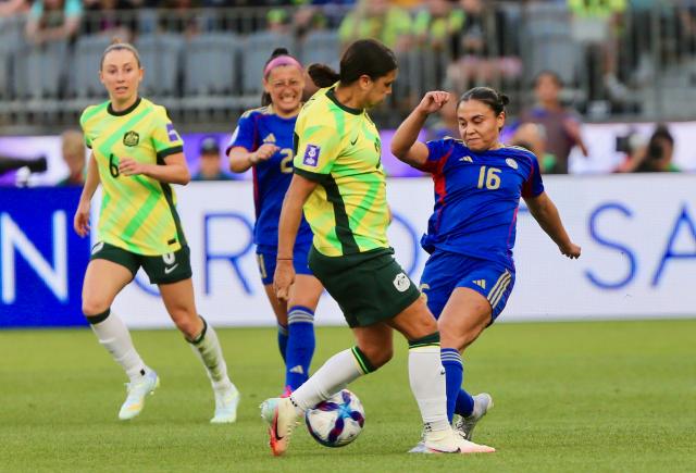 (260301) -- PERTH, March 1, 2026 (Xinhua) -- Sofia Nicole Wunsch (1st R) of the Philippines vies with Samantha Kerr (2nd R) of Australia during the group A opener match between Australia and the Philippines at the 2026 AFC Women's Asian Cup at Perth Stadium in Perth, Australia, March 1, 2026. (Photo by Zhou Dan/Xinhua)