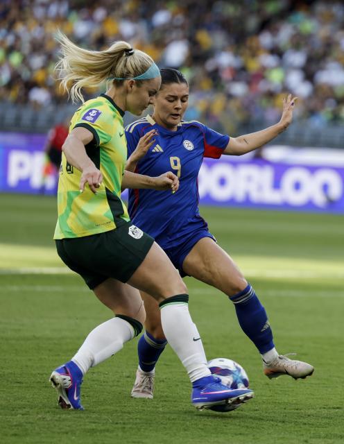 (260301) -- PERTH, March 1, 2026 (Xinhua) -- Carleigh Frilles (R) of the Philippines vies with Ellie Carpenter of Australia during the group A opener match between Australia and the Philippines at the 2026 AFC Women's Asian Cup at Perth Stadium in Perth, Australia, March 1, 2026. (Xinhua/Ma Ping)