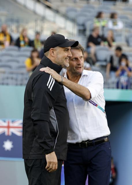 (260301) -- PERTH, March 1, 2026 (Xinhua) -- Joseph Montemurro (R), head coach of Australia, talks with Mark Torcaso, head coach of the Philippines, before the group A opener match between Australia and the Philippines at the 2026 AFC Women's Asian Cup at Perth Stadium in Perth, Australia, March 1, 2026. (Xinhua/Ma Ping)