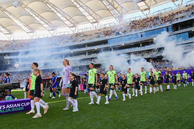 (260301) -- PERTH, March 1, 2026 (Xinhua) -- Players of both teams enter the pitch before the group A opener match between Australia and the Philippines at the 2026 AFC Women's Asian Cup at Perth Stadium in Perth, Australia, March 1, 2026. (Photo by Zhou Dan/Xinhua)