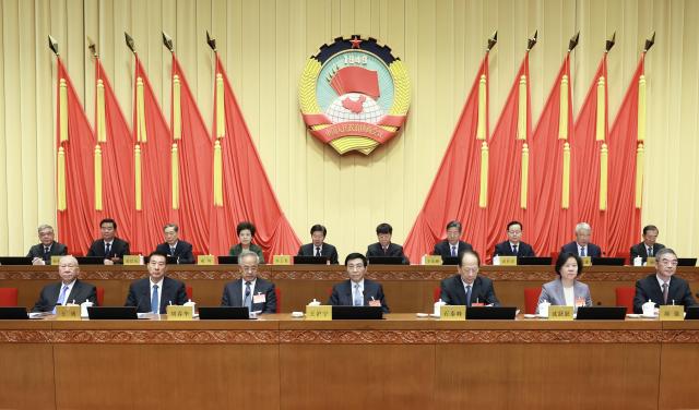 (260301) -- BEIJING, March 1, 2026 (Xinhua) -- Wang Huning, a member of the Standing Committee of the Political Bureau of the Communist Party of China Central Committee and chairman of the Chinese People's Political Consultative Conference (CPPCC) National Committee, attends the opening meeting of the 15th session of the Standing Committee of the 14th CPPCC National Committee in Beijing, capital of China, March 1, 2026. (Xinhua/Ding Lin)