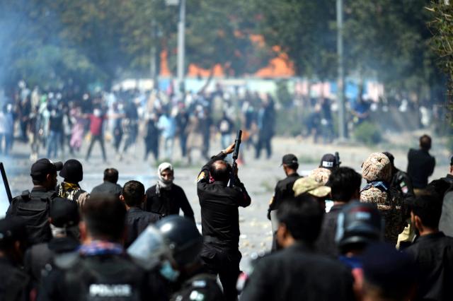 (260301) -- KARACHI, March 1, 2026 (Xinhua) -- Protesters clash with law enforcement personnel near U.S. Consulate in southern Pakistani port city of Karachi on March 1, 2026. At least nine people were killed and more than 12 others injured on Sunday as angry protesters clashed with law enforcement personnel outside the U.S. Consulate in Karachi in the southern Sindh province, rescue officials said. 
   The clashes erupted when demonstrators tried to enter the consulate premises, prompting security forces to respond, according to Rescue 1122 Sindh. (Photo by Imran Ali/Xinhua)