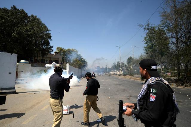 (260301) -- KARACHI, March 1, 2026 (Xinhua) -- A policeman fires teargas towards protestors during clash near U.S. Consulate in southern Pakistani port city of Karachi on March 1, 2026. At least nine people were killed and more than 12 others injured on Sunday as angry protesters clashed with law enforcement personnel outside the U.S. Consulate in Karachi in the southern Sindh province, rescue officials said. 
   The clashes erupted when demonstrators tried to enter the consulate premises, prompting security forces to respond, according to Rescue 1122 Sindh. (Photo by Imran Ali/Xinhua)