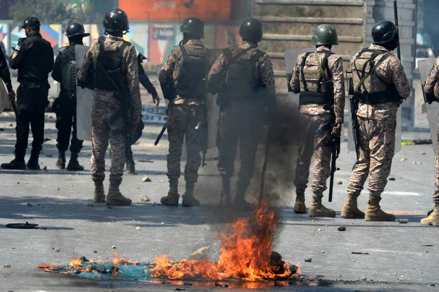 (260301) -- KARACHI, March 1, 2026 (Xinhua) -- Law enforcement personnel stand guard near U.S. Consulate in southern Pakistani port city of Karachi on March 1, 2026. At least nine people were killed and more than 12 others injured on Sunday as angry protesters clashed with law enforcement personnel outside the U.S. Consulate in Karachi in the southern Sindh province, rescue officials said. 
   The clashes erupted when demonstrators tried to enter the consulate premises, prompting security forces to respond, according to Rescue 1122 Sindh. (Photo by Imran Ali/Xinhua)