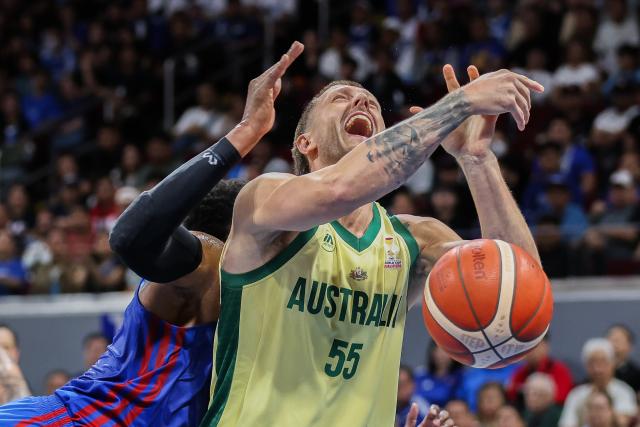 (260301) -- PASAY CITY, March 1, 2026 (Xinhua) -- Mitch Creek (front) of Australia competes against Justin Brownlee of the Philippines during the match between Australia and the Philippines at the FIBA World Cup Asian Qualifiers in Pasay City, the Philippines, on March 1, 2026. (Xinhua/Rouelle Umali)