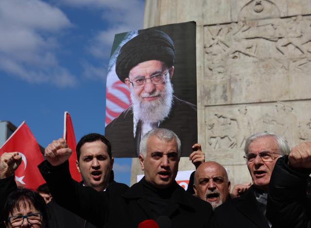(260301) -- ANKARA, March 1, 2026 (Xinhua) -- People hold an image of late Iran's Supreme Leader Ayatollah Ali Khamenei as they protest against the U.S.-Israeli strikes on Iran, in Ankara, Türkiye, March 1, 2026. (Mustafa Kaya/Handout via Xinhua)
