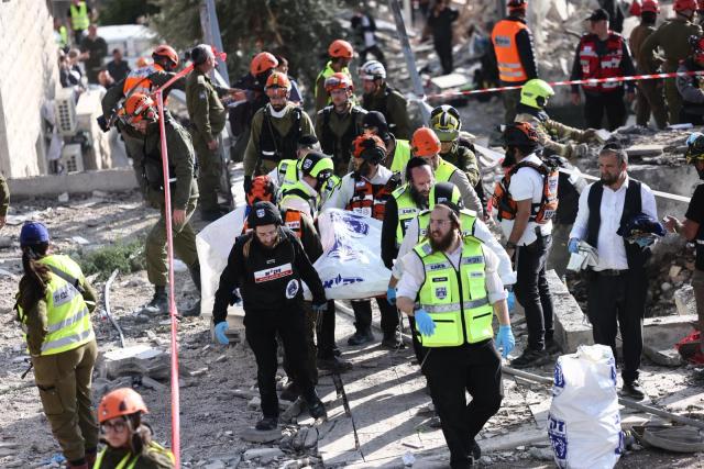 (260301) -- JERUSALEM, March 1, 2026 (Xinhua) -- Rescuers work at the site of a missile strike in Beit Shemesh, west of Jerusalem, March 1, 2026. Six people were killed and at least 23 were injured on Sunday when an Iranian missile struck a residential area in Beit Shemesh, west of Jerusalem, Israel's Magen David Adom rescue service spokesperson Zaki Heller said. (Photo by Jamal Awad/Xinhua)