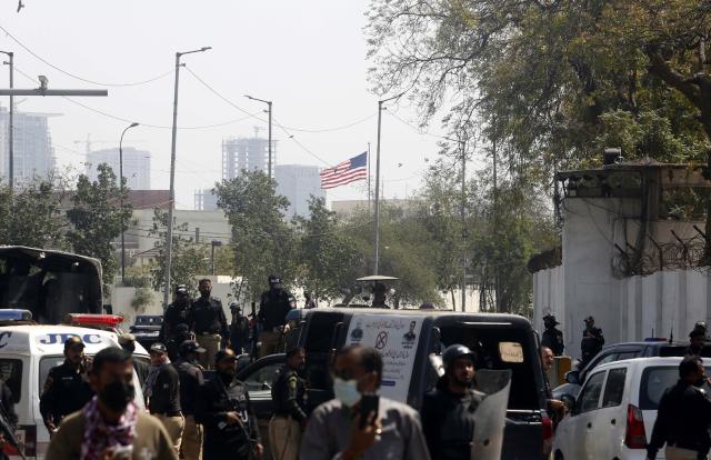 (260302) -- KARACHI, March 2, 2026 (Xinhua) -- Law enforcement personnel stand guard during clashes with anti-U.S. protesters near the U.S. Consulate in southern Pakistani port city of Karachi on March 1, 2026. Twenty people were killed and over 100 others injured in anti-U.S. demonstrations in Pakistan on Sunday, police sources told Xinhua. (Photo by Imran Ali/Xinhua)