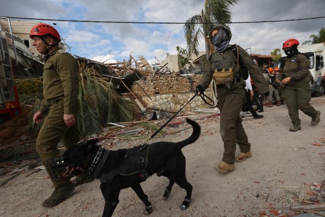 (260302) -- JERUSALEM, March 2, 2026 (Xinhua) -- Rescuers work at the site of a missile strike in Beit Shemesh, west of Jerusalem, March 1, 2026. Eight people were killed and at least 23 were injured on Sunday when an Iranian missile struck a residential area in Beit Shemesh, west of Jerusalem, according to local media reports. (Photo by Gil Cohen Magen/Xinhua)