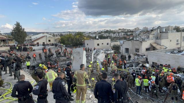 (260302) -- JERUSALEM, March 2, 2026 (Xinhua) -- This photo taken on March 1, 2026 shows the site of a missile strike in Beit Shemesh, west of Jerusalem. Eight people were killed and at least 23 were injured on Sunday when an Iranian missile struck a residential area in Beit Shemesh, west of Jerusalem, according to local media reports. (Photo by Gil Cohen Magen/Xinhua)