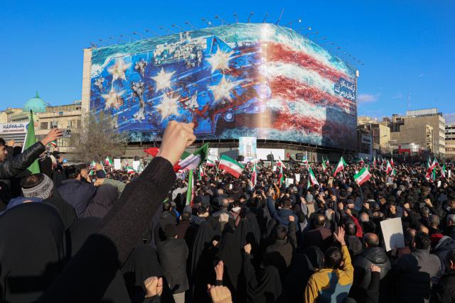 (260301) -- TEHRAN, March 1, 2026 (Xinhua) -- People gather to mourn the death of Iran's Supreme Leader Ayatollah Ali Khamenei in Tehran, Iran, March 1, 2026. Iran's state media confirmed Sunday that its Supreme Leader Ayatollah Ali Khamenei was killed in a joint U.S.-Israeli attack on Saturday, prompting Iranian missile strikes on Israel and U.S. targets across the region. (Mehr News Agency/Handout via Xinhua)