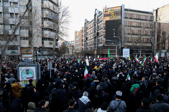 (260301) -- TEHRAN, March 1, 2026 (Xinhua) -- People gather to mourn the death of Iran's Supreme Leader Ayatollah Ali Khamenei in Tehran, Iran, March 1, 2026. Iran's state media confirmed Sunday that its Supreme Leader Ayatollah Ali Khamenei was killed in a joint U.S.-Israeli attack on Saturday, prompting Iranian missile strikes on Israel and U.S. targets across the region. (Mehr News Agency/Handout via Xinhua)