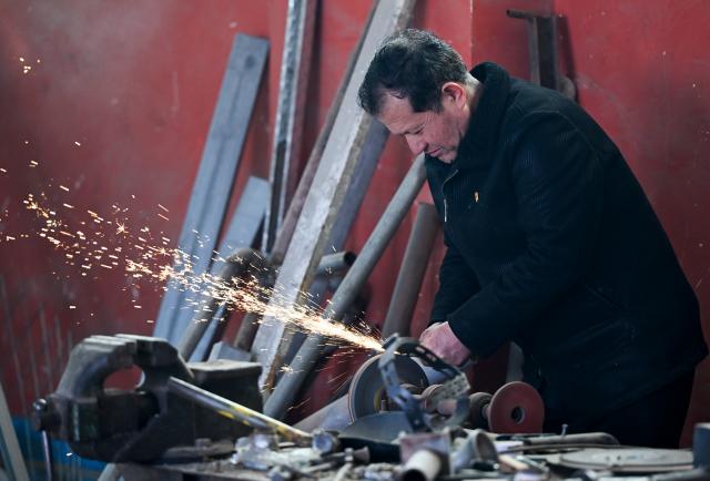 (260301) -- XINYUAN, March 1, 2026 (Xinhua) -- Musajan Khairat welds at his workshop in Keregetas Village, Xinyuan County of Ili Kazak Autonomous Prefecture, northwest China's Xinjiang Uygur Autonomous Region, Feb. 9, 2026.
  Musajan Khaira, a villager of Keregetas Village of Xinyuan County, is a deputy to the National People's Congress (NPC). After graduating from junior high school, he learned blacksmithing and welding skills and runs a welding workshop. In addition to pursuing a better life for his own family, Musajan also taught welding skills to villagers for free, helping local people to increase their incomes.
  As an NPC deputy, Musajan consistently focuses on the demands of local people. In response to villagers' concerns about difficulties in farmland irrigation and road accessibility, he presented a suggestion on construction of high-standard farmland at a ravine area in Xinyuan County. With his efforts, a high-standard farmland construction project was launched and drip irrigation facilities were promoted, making it easier for farmers to cultivate the land and ensuring more stable income growth.
  Musajan keeps concentrating on high-quality development of rural areas. He presented suggestions such as advancing the reconstruction and expansion of local airport, upgrading county roads, and protecting wetland ecosystems, to promote rural development and improve local people's well-being. (Xinhua/Wang Fei)