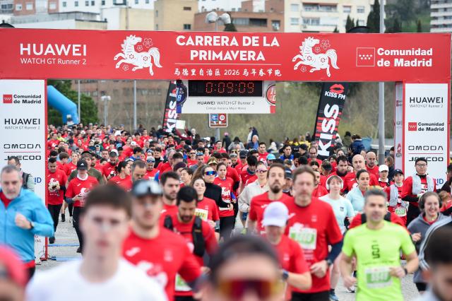 (260302) -- MADRID, March 2, 2026 (Xinhua) -- People run during an event in celebration of the Chinese New Year in Madrid, Spain, on March 1, 2026. (Photo by Gustavo Valiente/Xinhua)