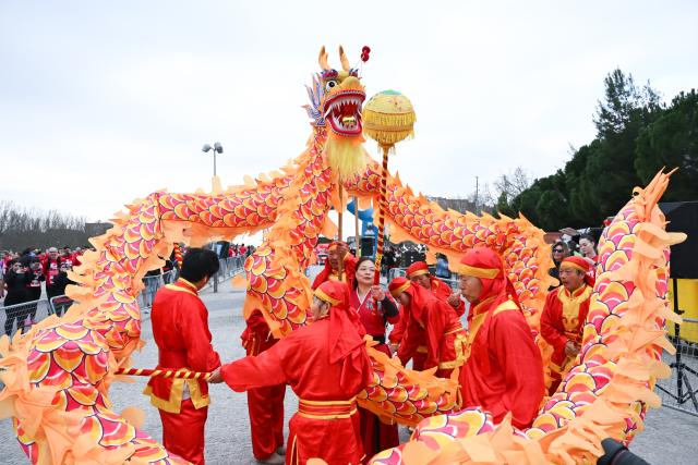 (260302) -- MADRID, March 2, 2026 (Xinhua) -- People perform the dragon dance during an event in celebration of the Chinese New Year in Madrid, Spain, on March 1, 2026. (Photo by Gustavo Valiente/Xinhua)