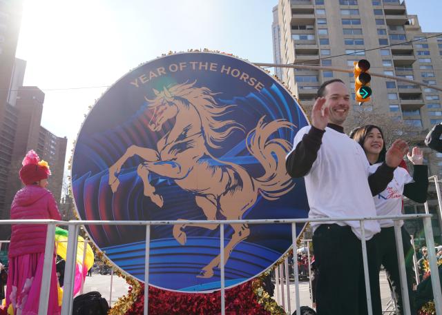 (260302) -- NEW YORK, March 2, 2026 (Xinhua) -- People attend a Chinese New Year parade in New York, the United States, March 1, 2026. A parade was held here to celebrate the Chinese New Year on Sunday. (Xinhua/Zhang Fengguo)