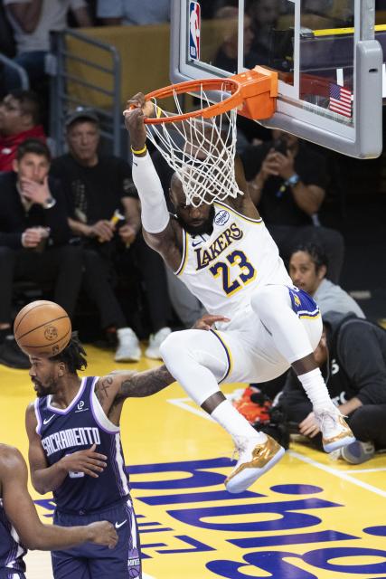 (260302) -- LOS ANGELES, March 2, 2026 (Xinhua) -- Los Angeles Lakers' LeBron James (R) dunks during the 2025-2026 NBA regular season basketball game between Los Angeles Lakers and Sacramento Kings in Los Angeles, the United States, March 1, 2026. (Photo by Ringo Chiu/Xinhua)