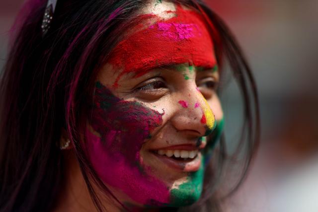 (260302) -- KATHMANDU, March 2, 2026 (Xinhua) -- A woman smeared with colored powder is pictured during a celebration of the Holi Festival in Kathmandu, Nepal, on March 2, 2026. Holi, the festival of colors, marks the end of winter and the onset of the spring season. (Photo by Sulav Shrestha/Xinhua)
