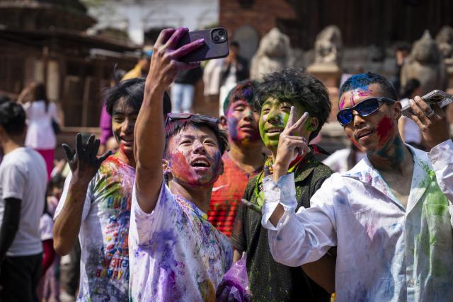 (260302) -- LALITPU, March 2, 2026 (Xinhua) -- People smeared with colored powder are pictured during a celebration of the Holi Festival in Lalitpur, Nepal, on March 2, 2026. Holi, the festival of colors, marks the end of winter and the onset of the spring season. (Photo by Hari Maharjan/Xinhua)