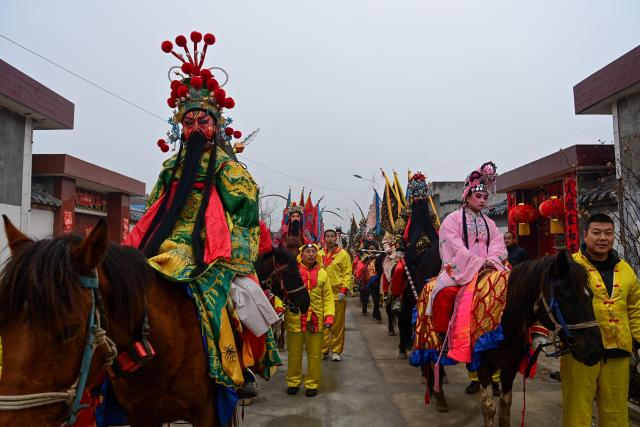 (260302) -- BAOJI, March 2, 2026 (Xinhua) -- Performers attend a Shehuo parade in Huanghuayu Village in Longxian County of Baoji City, northwest China's Shaanxi Province, March 2, 2026.
  Shehuo is a type of traditional Chinese folk art form. Longxian County held a special local Shehuo parade on Monday, which features performers on horseback adorned with simple yet exquisite facial make-up.
  The Shehuo parade is a long-standing and widely popular performance in rural China. It originated in ancient sacrificial ceremonies held to pray for good harvests about 2,000 years ago.
  Over time, as dance and song performances were incorporated, it gradually evolved into a folk custom staged during the Spring Festival and Lantern Festival, believed to ward off bad luck and usher in a fresh start for the new year.
  The Shehuo folk performance in Baoji was added to China's national intangible cultural heritage list in 2006. In recent years, the local Shehuo tradition in Longxian County has continued to thrive through ongoing inheritance and innovation. (Xinhua/Zou Jingyi)
