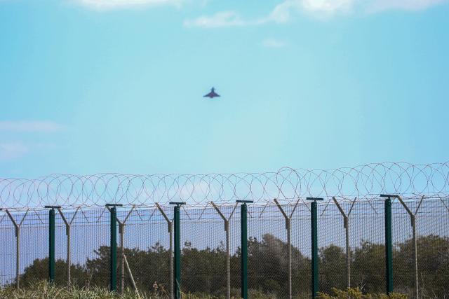 (260302) -- NICOSIA, March 2, 2026 (Xinhua) -- A military fighter aircraft is seen over the RAF (Royal Air Force) base in Akrotiri, Cyprus, on March 2, 2026. The British air base at Akrotiri on the southern coast of Cyprus was hit by a drone early Monday, base authorities and the Cypriot government said. (Photo by George Christophorou/Xinhua)