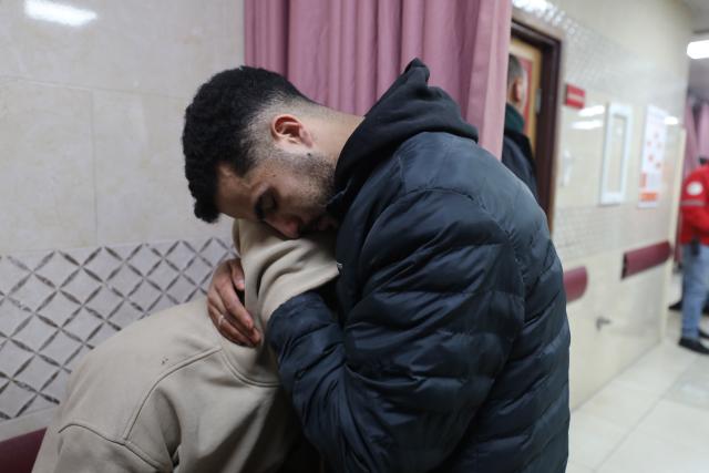 (260302) -- NABLUS, March 2, 2026 (Xinhua) -- Palestinians mourn for their relative, who was killed by Israeli settlers, at a hospital in Nablus, the northern West Bank, on March 2, 2026. Two Palestinian men were shot dead on Monday by Israeli settlers in the southern area of the West Bank city of Nablus, the Ramallah-based Palestinian health ministry said. (Photo by Nidal Eshtayeh/Xinhua)